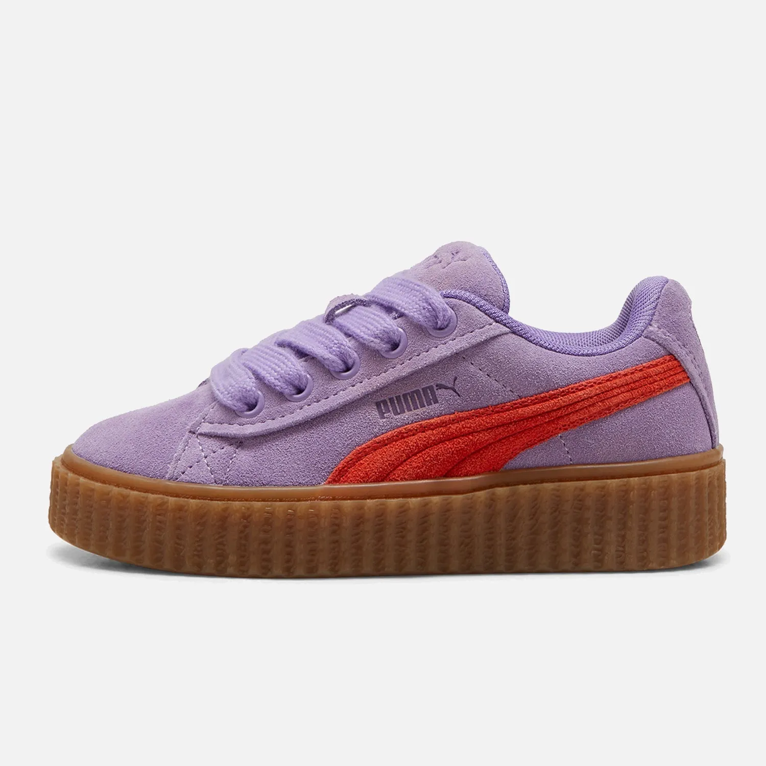 Women's Puma x Fenty Phatty Lavender running on an outdoor track shoes running in a butte area shoes