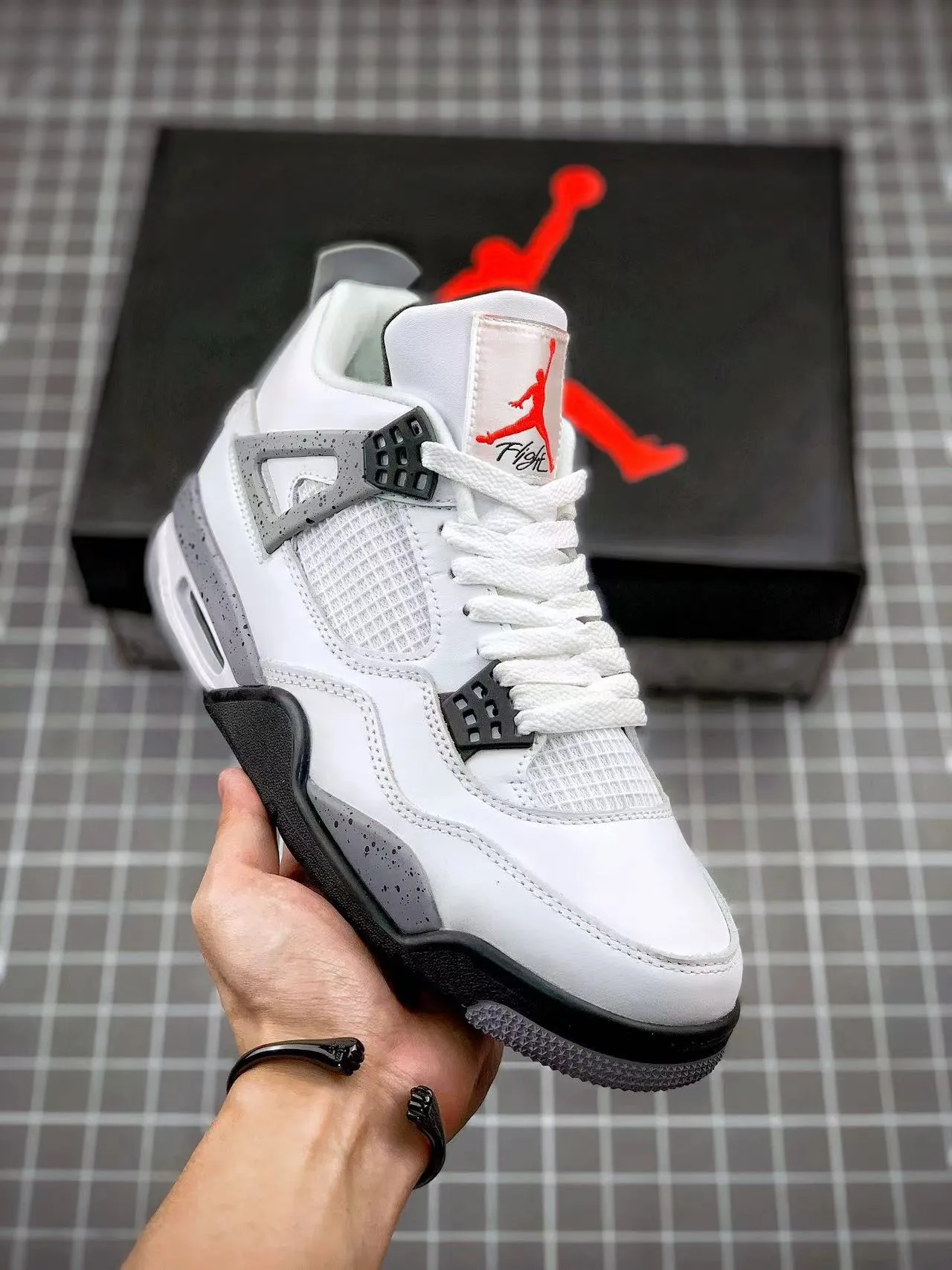 Fashion-Forward Look AJ 4 Retro White Cement