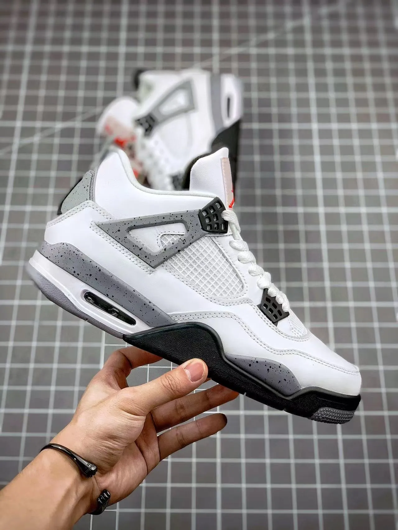 Fashion-Forward Look AJ 4 Retro White Cement