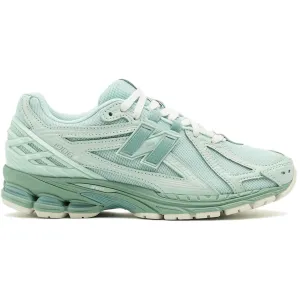 running on asphalt New Balance 1906R Jade Green